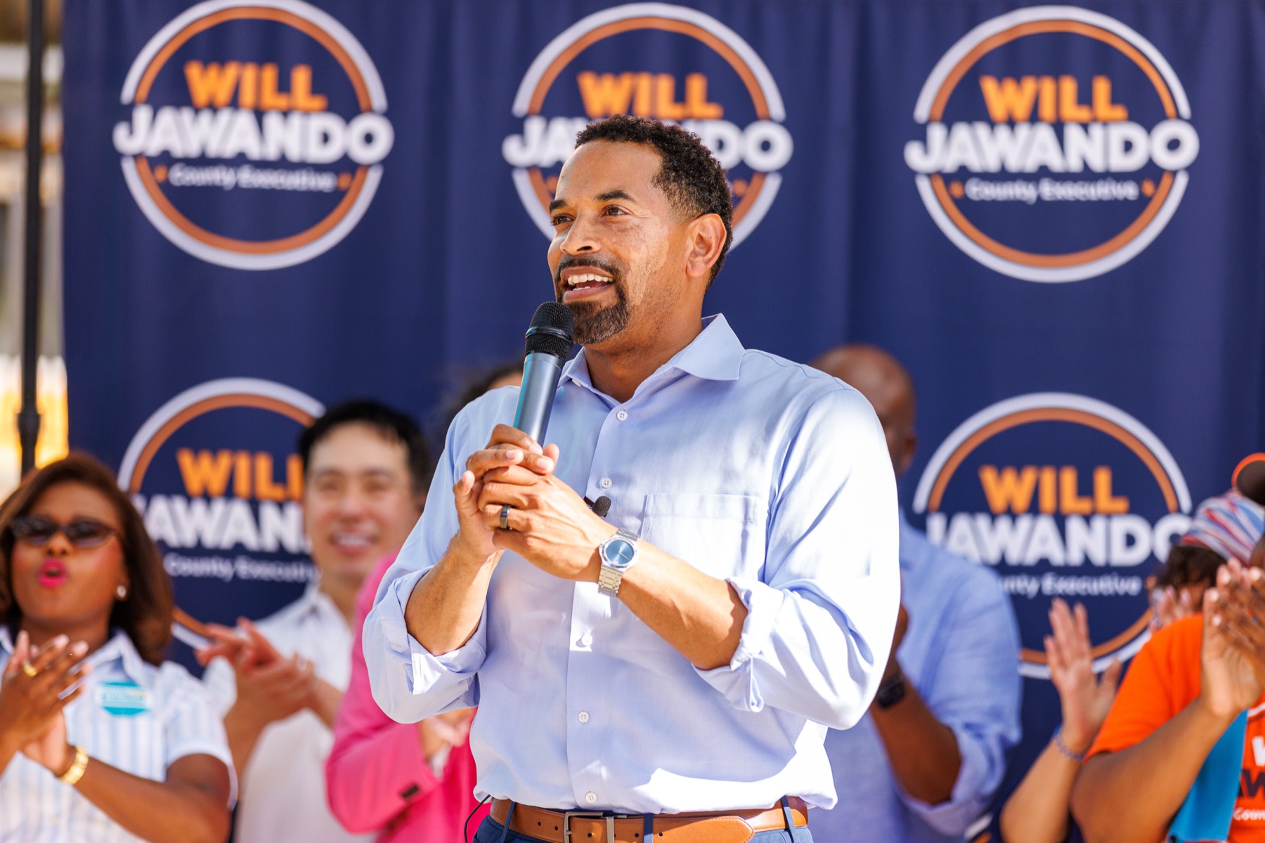 Will Jawando with supporters at a campaign event